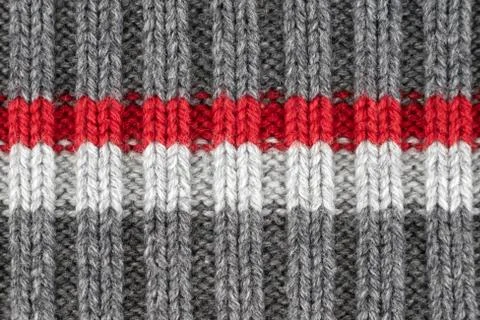 Pattern by gray, red and white knitting wool yarn texture, kraft handmade Stock Photos