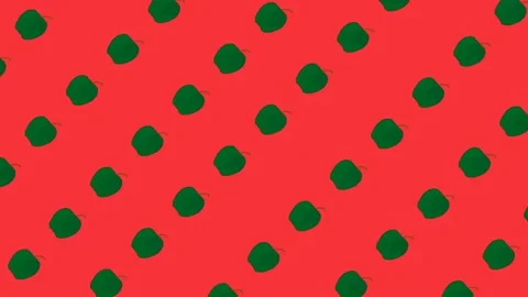 Pattern green apples fly diagonally on a red background loop Stock Footage