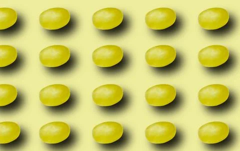 Pattern with green grapes with a shadow on a light green background. 스톡 사진