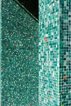 A pattern of green tiles in daylight Stock Photos