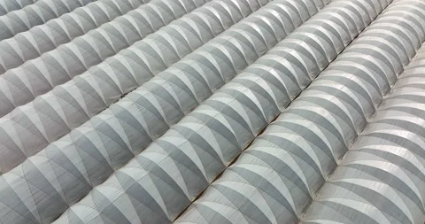 Pattern of greenhouse white plastic to warm plants in cold growing winter Stock Footage 188776238