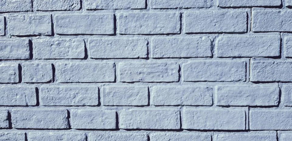 Pattern grey or gray brick wall painted for background in vintage tone. Stock Photos