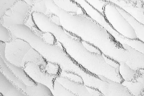 Pattern on a grey powder surface Stock-Fotos