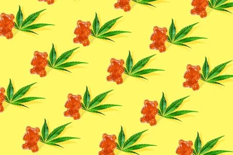 Pattern gummies form of bear with CBD oil , yellow background Minimalism conc Stock Photos