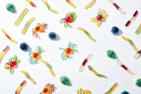 Pattern gummy spiders worms isolated Stock Photos