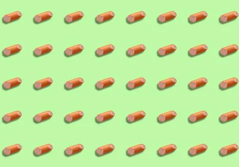 A pattern with half a sausage cut off on a green background. Product template 스톡 사진