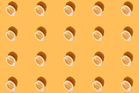  Pattern with halves of lemon collection with shadow on orange background ... Foto stock