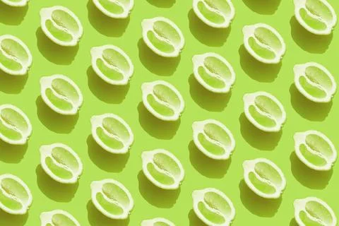  Pattern with halves of lemon with shadow on green background Conceptual p... Stock Photos