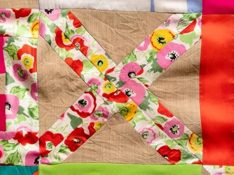 Pattern on hand-stitched colorful patchwork cloth Stock Photos