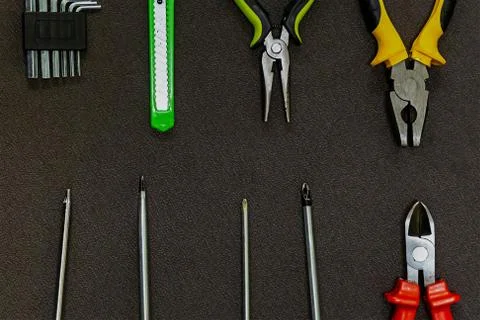 Pattern hand tool set screwdriver nippers red yellow knife L-shaped Hex Stock Photos