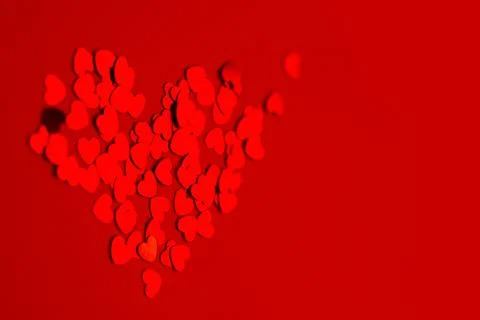 A pattern of hearts on a red background. Valentine's Day concept. 库存照片