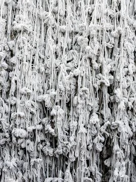 Pattern of holy thread background. Many white tassels made of many tied hol.. 스톡 사진