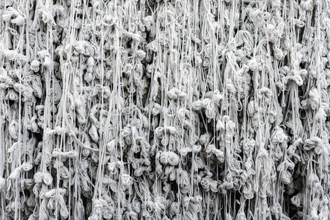 Pattern of holy thread background. Many white tassels made of many tied hol.. Foto stock