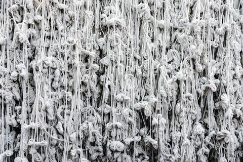 Pattern of holy thread background. Many white tassels made of many tied hol.. Foto stock