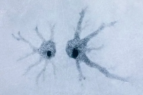 Pattern on ice in the form of two spiders Stock Photos