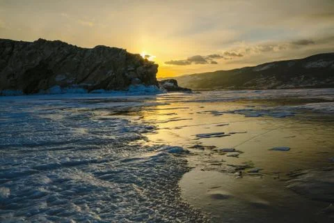 Pattern on ice of lake Baikal during sunset. Siberia Russia Stock Photos