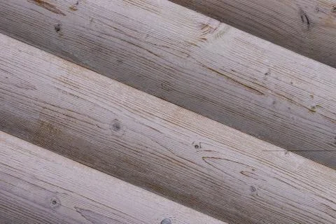 Pattern inclined logs light gray ribbed background wooden base Stock Photos