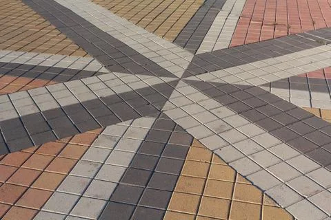 Pattern of inlaid colored paving slabs. Backgrounds and textures Stock Photos
