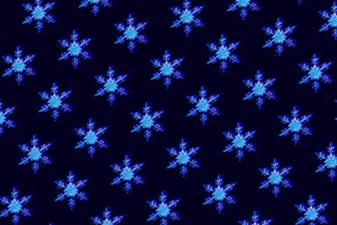 Pattern with interlaced snowflakes on dark blue background Stock Photos