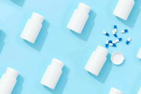 Pattern with jar pills vitamins bio additives on a blue background with deep Stock Photos