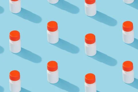 Pattern with jar pills vitamins bio additives on a blue background with deep Stock Photos