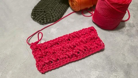 Pattern for knitting a bag. Crocheted from polyester cord. On a gray backgrou Stock Photos