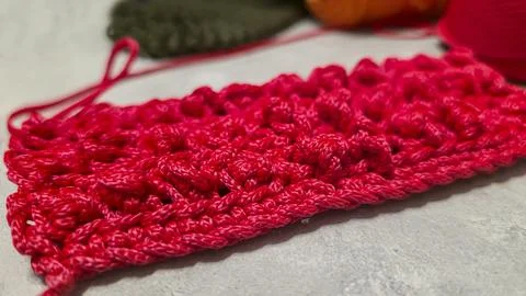 Pattern for knitting a bag. Crocheted from polyester cord. On a gray backgrou Stock Photos