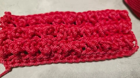 Pattern for knitting a bag. Crocheted from polyester cord. On a gray backgrou Stock Photos