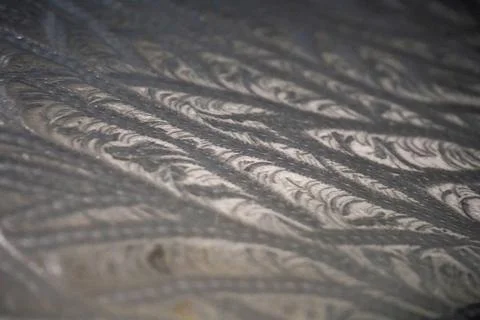Pattern left by freezing ice on a flat surface 库存照片
