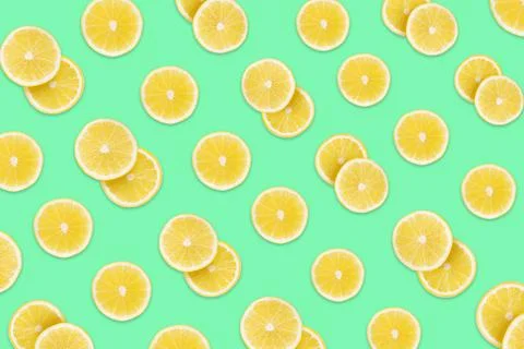 Pattern of lemon slices on aquamarine background Fotos de archivo