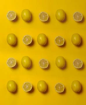 Pattern of lemons in a yellow background Stock Photos