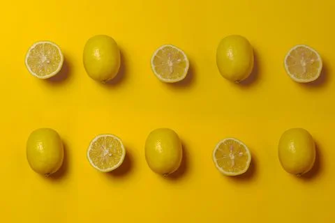 Pattern of lemons in a yellow background Stock Photos