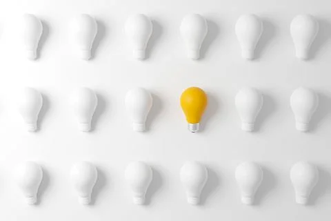 Pattern light bulb yellow outstanding among lightbulb group. Concept of creat Stock Photos