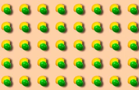 A pattern with lime and lemon on a beige background. Fruity citrus background. 스톡 사진