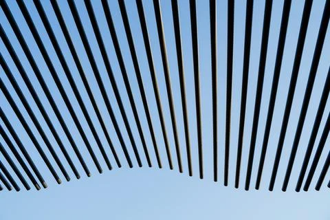 The pattern of the line of tubes sticking out into the sky, black wavy sticks Stock Photos