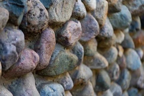 The pattern lining the old stone walls made of stones of different sizes, sel Foto stock