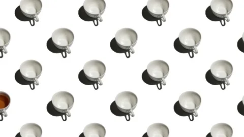 Pattern with lonely cup of tea and many empty cups animated on wite background Stock Footage 135170707