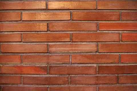 Pattern of long red bricks wall background Stock Photos