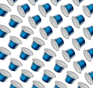Pattern made of blue no logo new fresh aluminum coffee capsules isolated over Stock Photos
