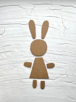 Pattern made of cardboard, hare, rabbit, cardboard recycling, kids crafts. Stock Photos