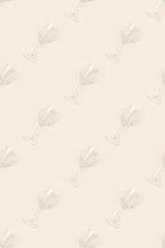 Pattern made of crystal glasses on a beige background. Stock Photos