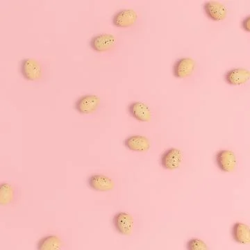 Pattern made of easter eggs on a pink pastel background. Stock Photos