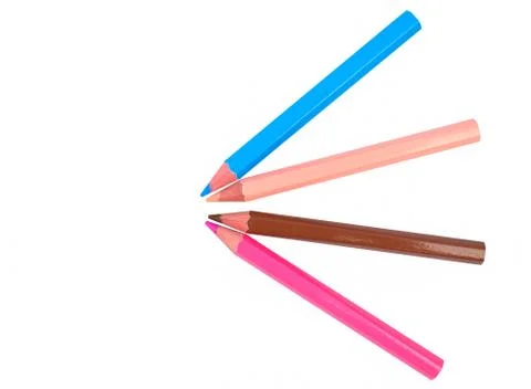 A pattern made with four different colored wood pencil crayons on white paper Stock Photos