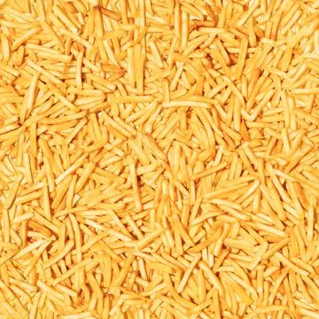 Pattern made from fried potato. Top view, flat design. Fast food. Stock Photos