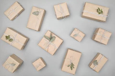 Pattern made of gift boxes on solid gray background Stock Photos