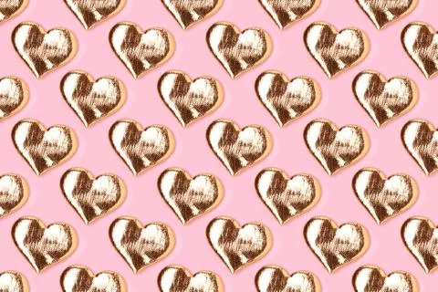 Pattern made of golden hearts. Stock Photos