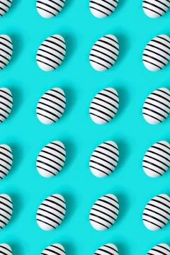 Pattern made of hand drawn eggs on blue pastel background. Stock Photos