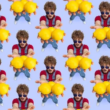 Pattern made with high angle view of funny young man, farmer with big lemons Foto stock