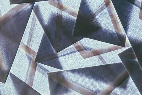A pattern made by laying and overlapping security envelopes above a lightsour Stock Photos