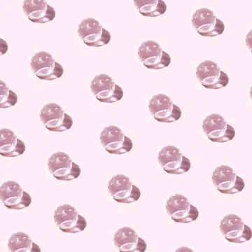 Pattern made of Luminous bright crystal glass transparent ball against pastel Stock Photos